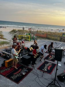 Live band playing on the beach at sunset in Panama City Beach