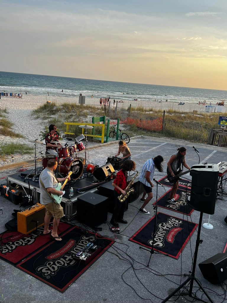 Live band playing on the beach at sunset in Panama City Beach