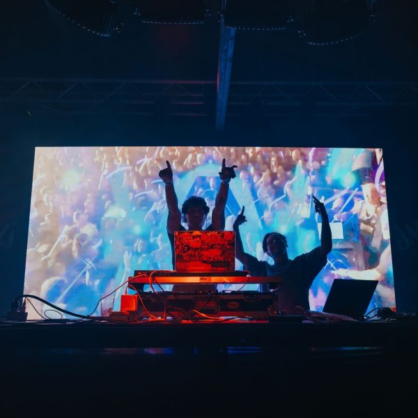 DJ arms up wide stage screen, PCB Spring Break 2026