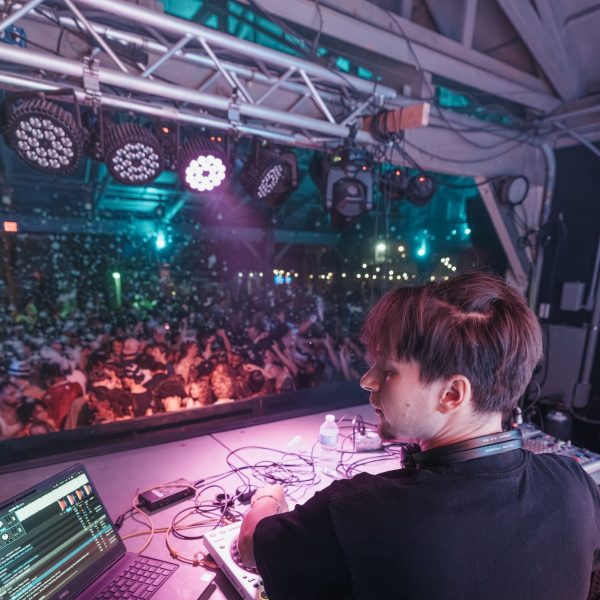 DJ over crowd pink, PCB Spring Break 2026
