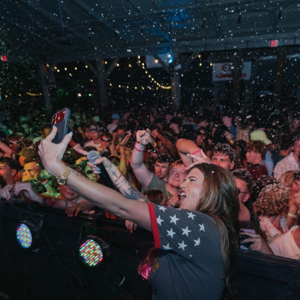 Performer selfie with huge crowd wide, PCB Spring Break 2026