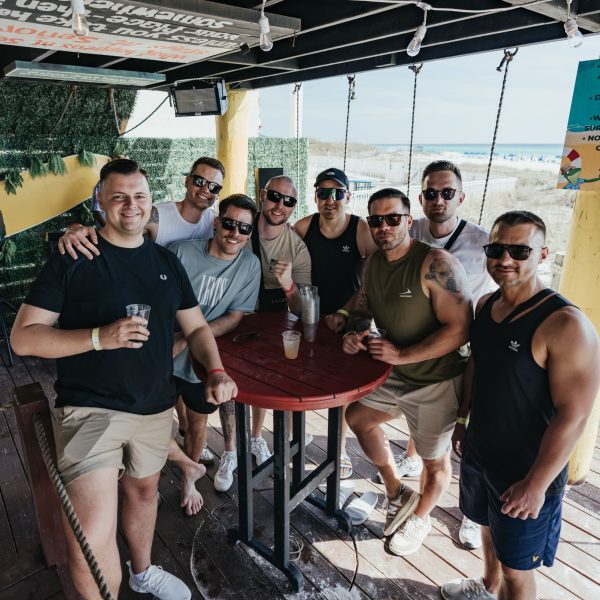 Group of guys at table day, PCB Spring Break 2026