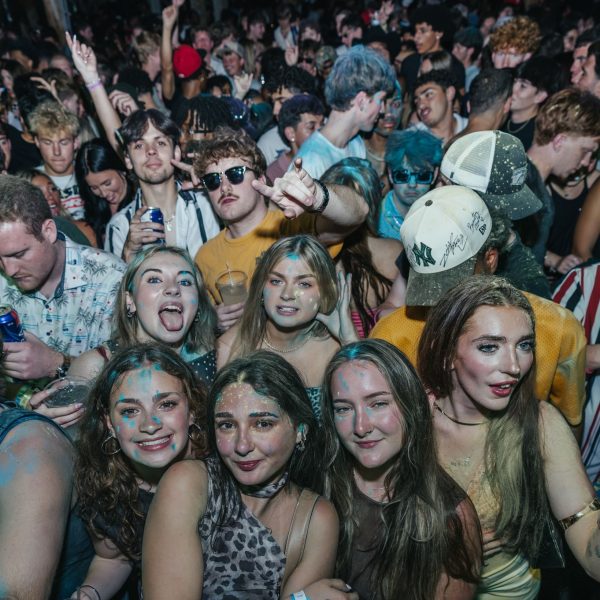 Girls and guys at rail, PCB Spring Break 2026