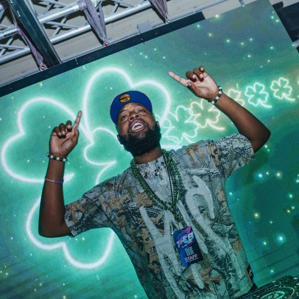 DJ with shamrock screen (St Patricks), PCB Spring Break 2026