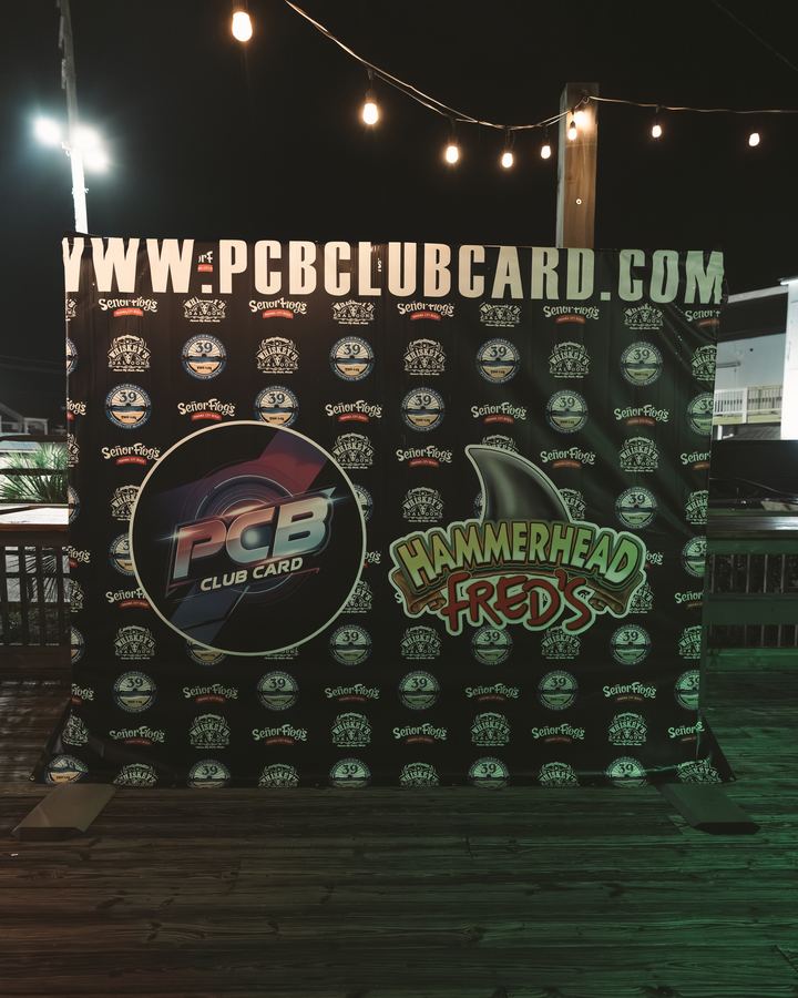 PCB Club Card photo backdrop with the Hammerhead Fred's logo