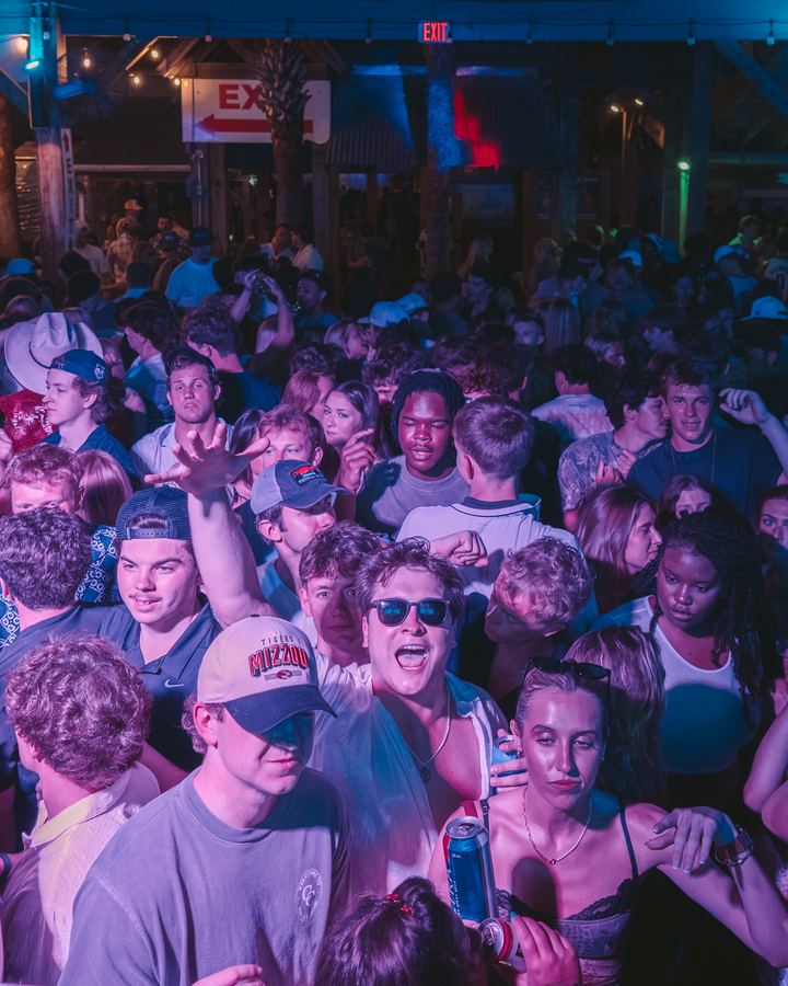 Crowd facing the camera at a Spring Break party