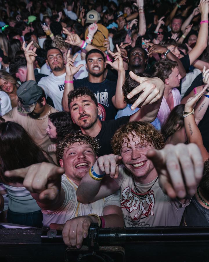 Crowd pointing at the camera