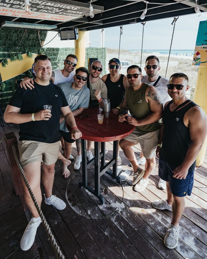 Group of friends around a table on a sunny deck