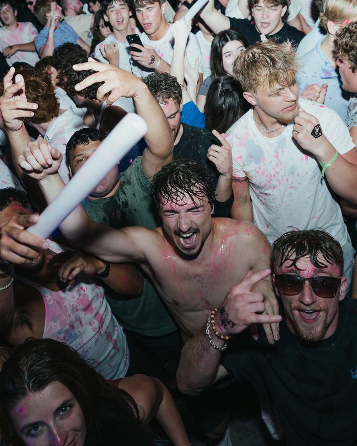 Crowd covered in colored powder