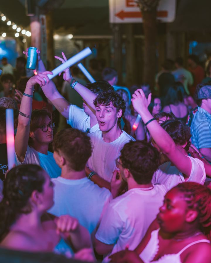 Energetic crowd with glow sticks
