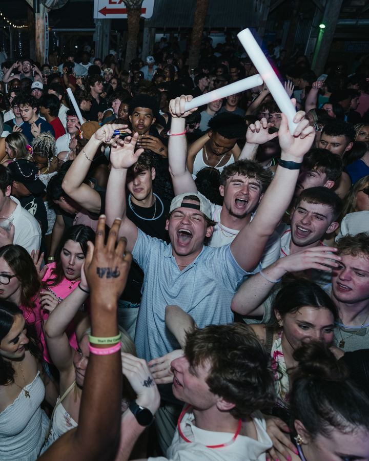 Crowd waving glow sticks